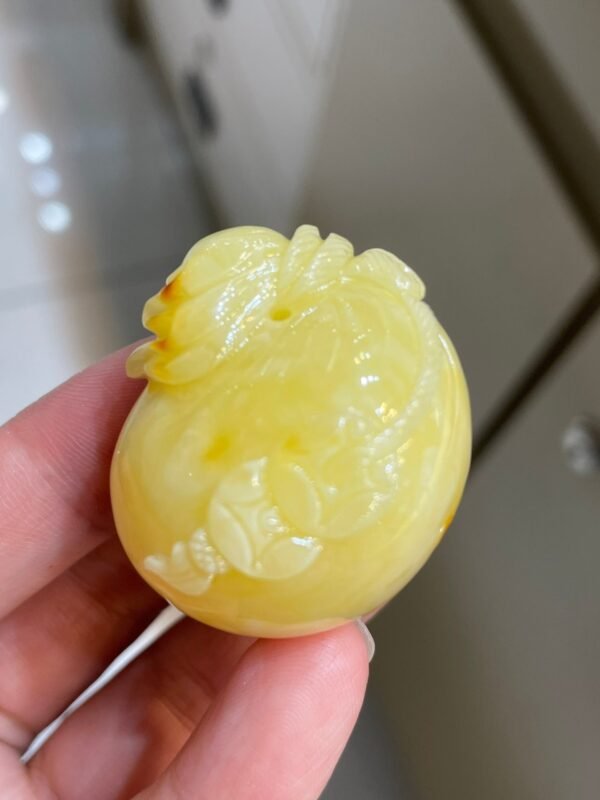 The natural raw mineral white flower cleverly carved and colorful honey wax money bag pendant is approximately 36.6x31.9x29.4mm in size0811790133